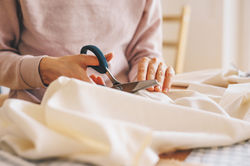 Woman Cutting Fabric